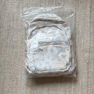 Cream Backpack with Blue Bow Print